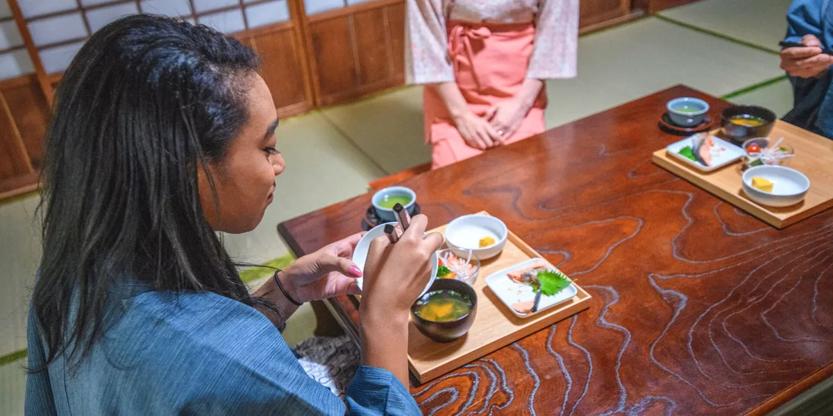 Guest with traditional Japanese cuisine