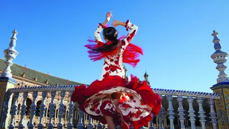 Lady dancing on terrace in Seville