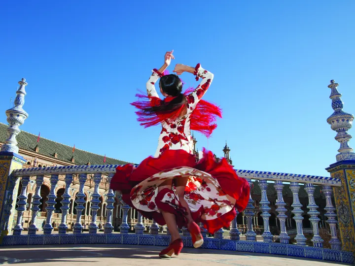Lady dancing on terrace in Seville
