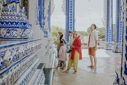 Grandparent explains the history of a beautiful temple to her family