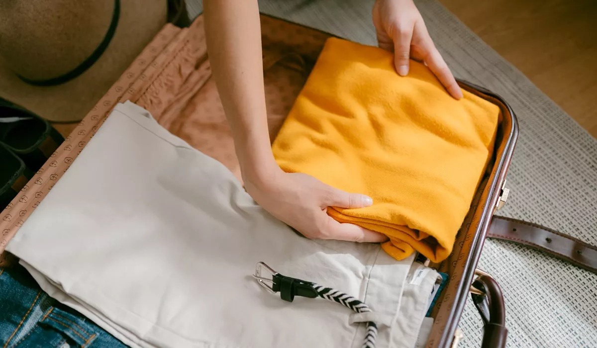 Woman packing a suitcase