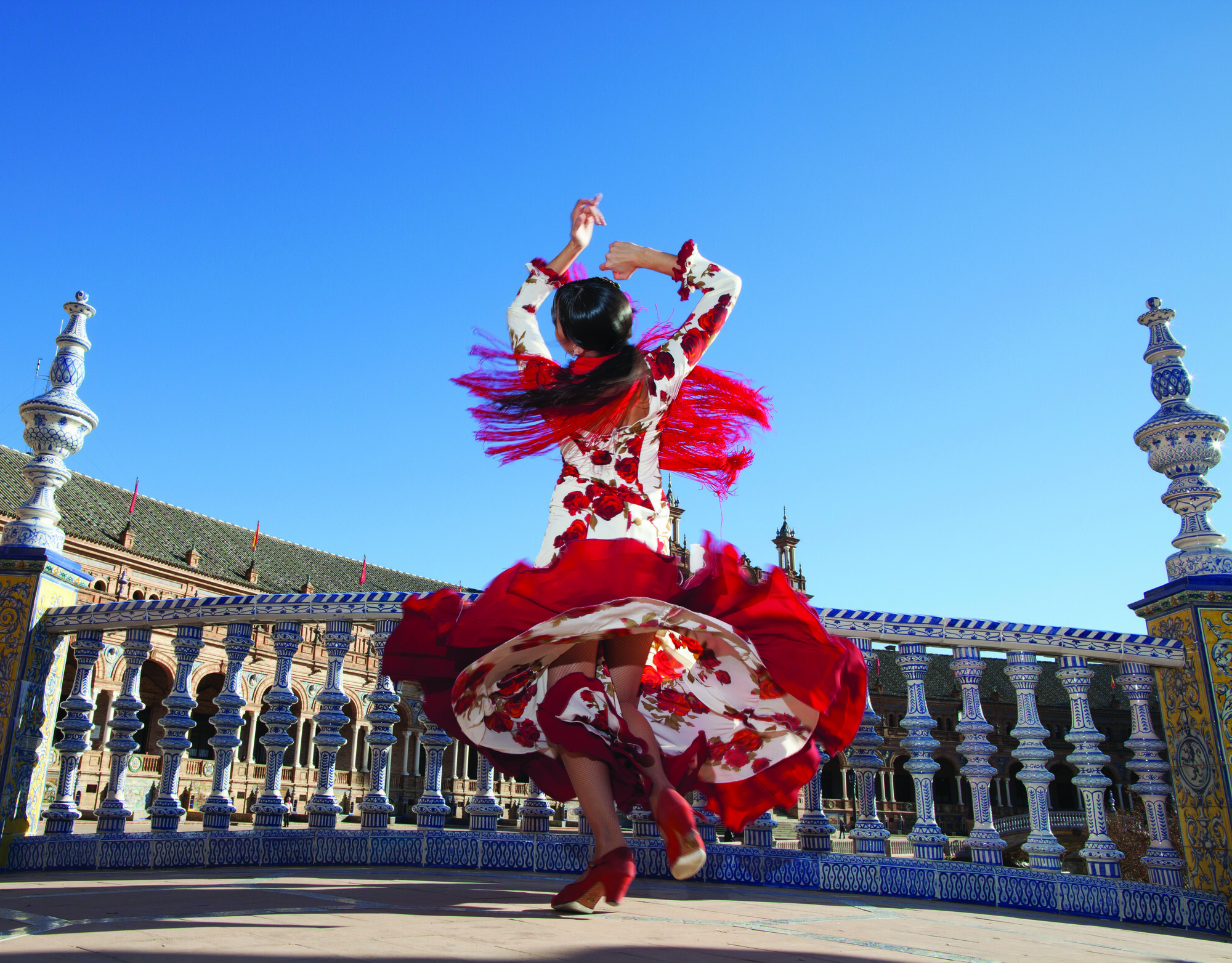 Lady dancing on terrace in Seville