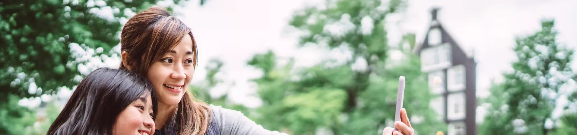 Mom Taking Selfie With Her Teenage Daughter