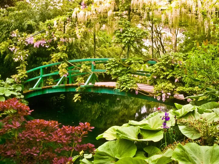 Monet's iconic bridge, a Japanese inspired bridge over a pond of water lilies in Giverny, France