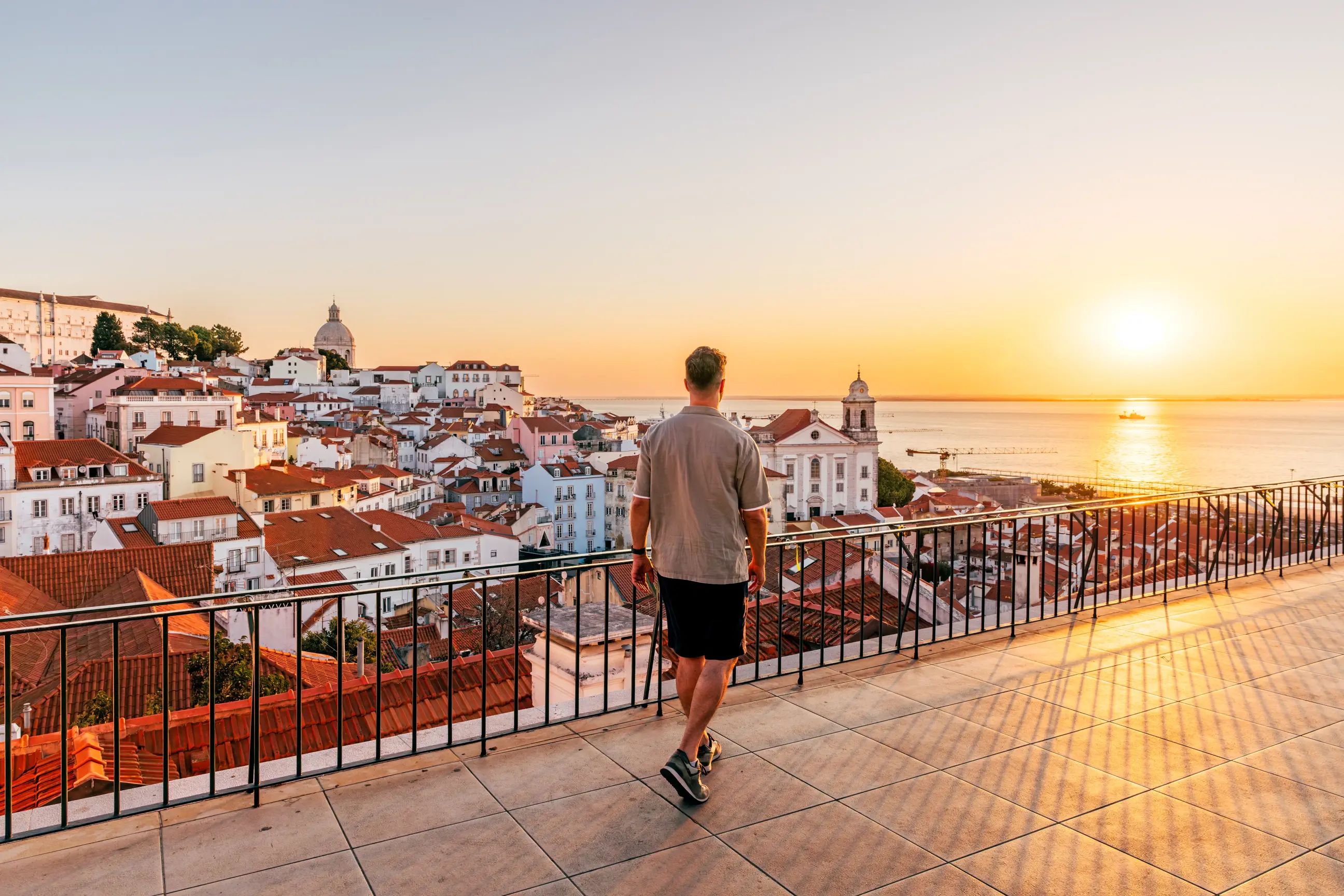day-hero-sunrise-from-portas-do-sol-miradouro-in-lisbon-portugal-2242588705.webp