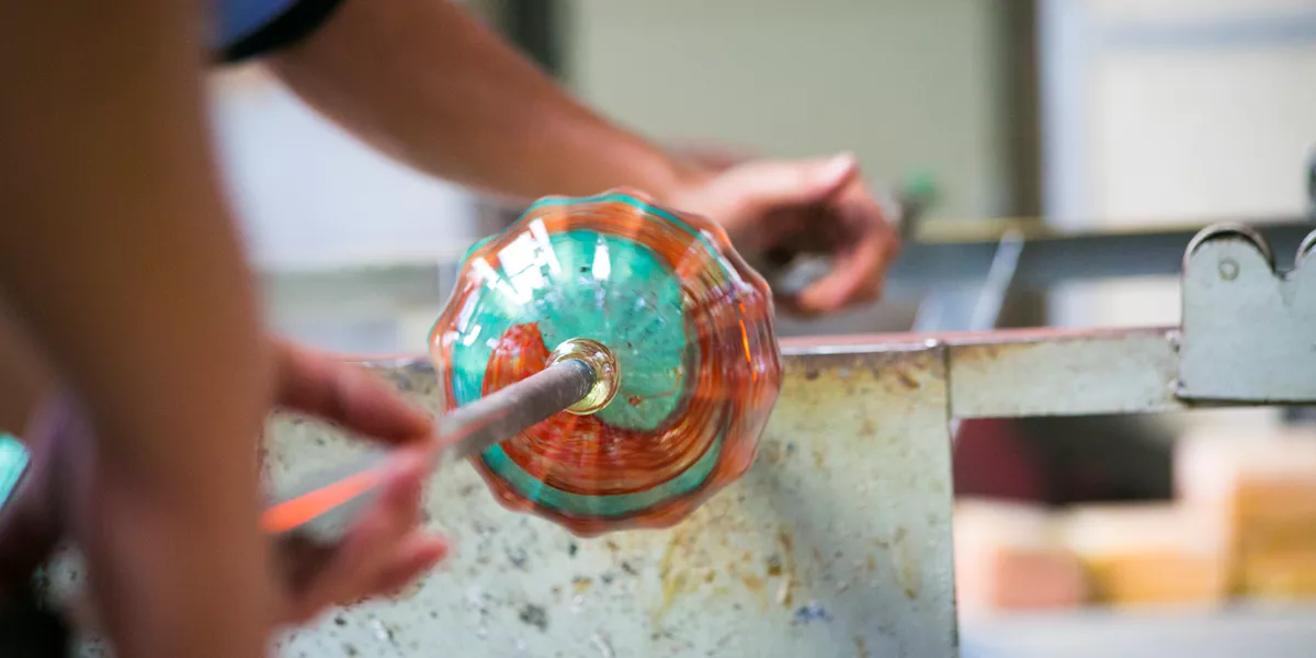 Glass being handcrafted in the glassblowing process
