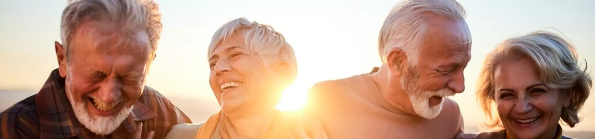 Mature Couples Talking While Walking In Autumn Day
