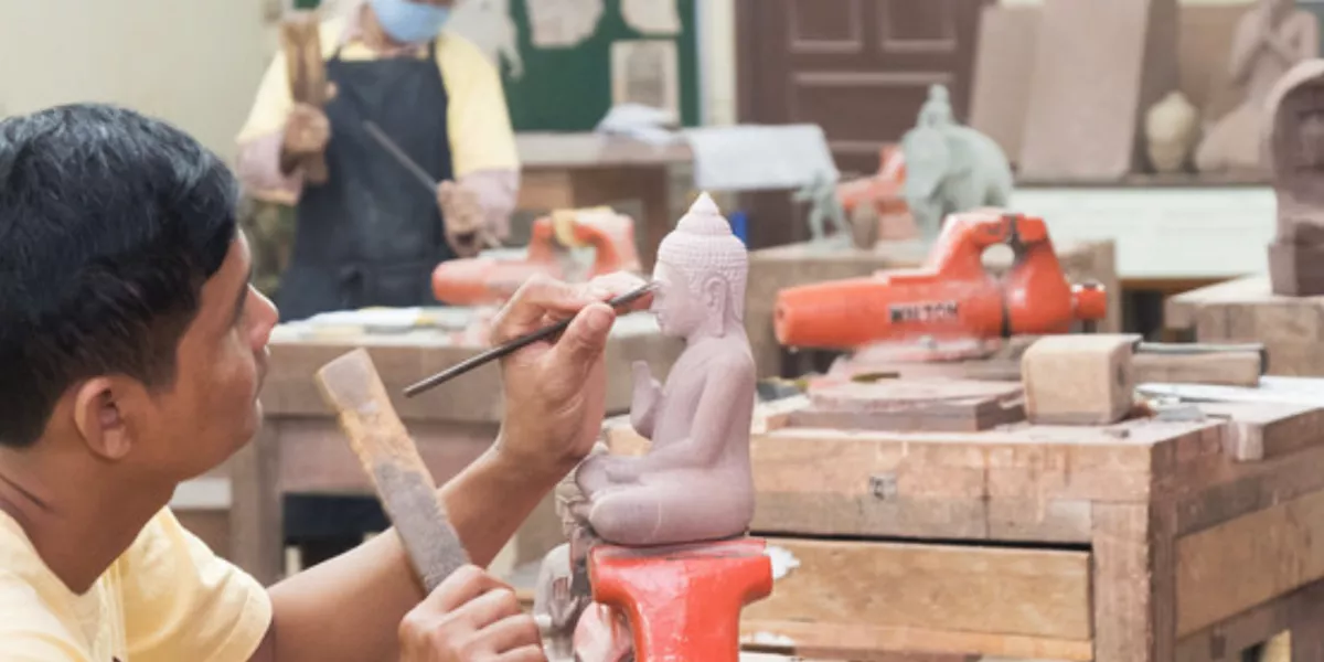 Artisans creating Buddha sculptures in Angkor Siem Reap, Cambodia