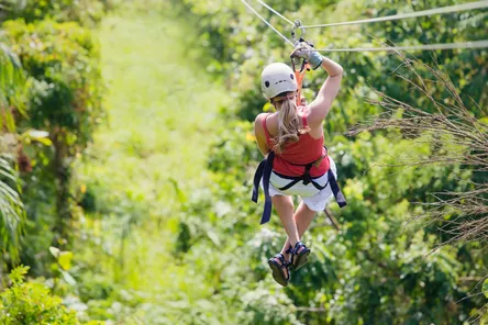 Woman Going On A Jungle Zipline Adventure, Costa Rica