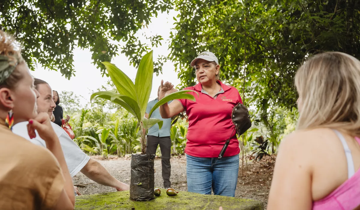 Woman Guiding In Front Of A Group Of People