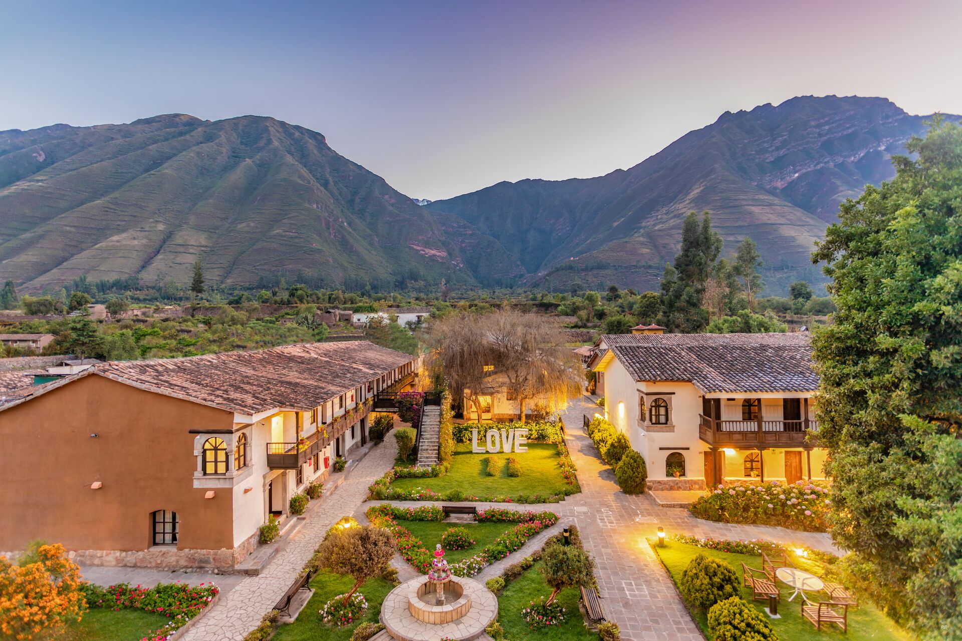 Photo from above of hotel in Peru in front of mountain
