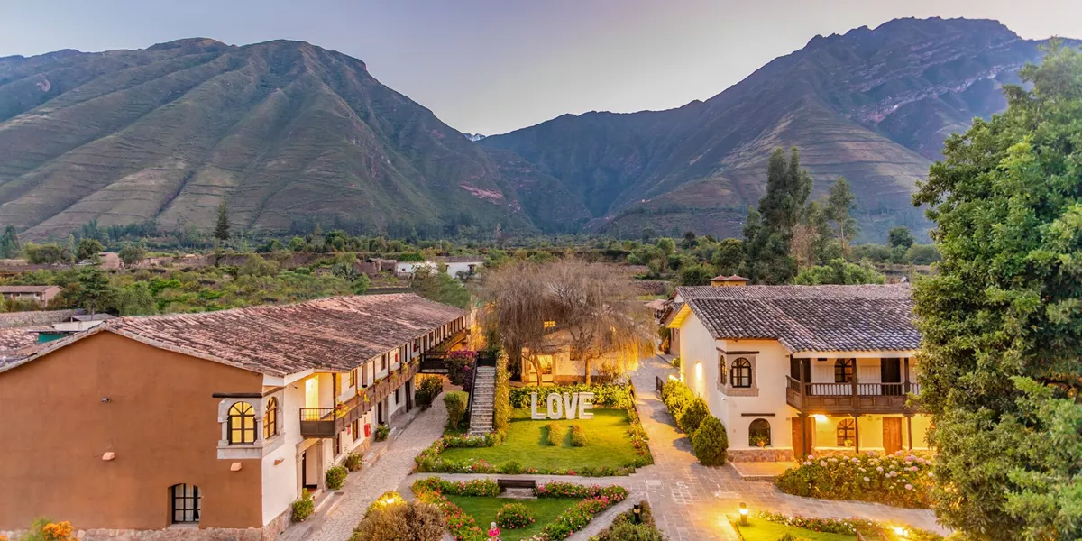 Photo from above of hotel in Peru in front of mountain