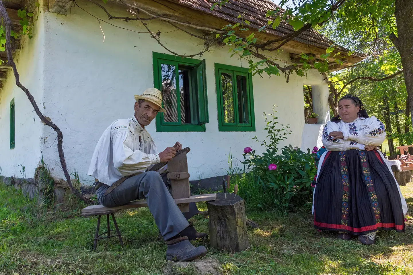 View of couple, in traditional Romanian folk costume, Muzeul Astra Ethnographic Park, Sibiu, Romania