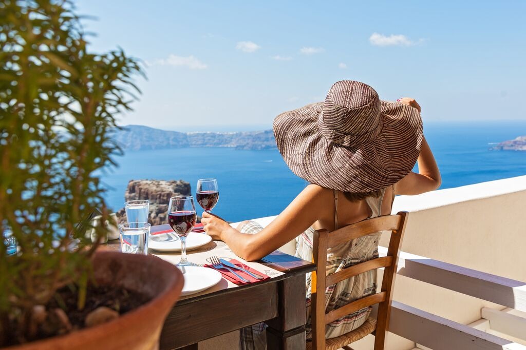 Young beautiful woman drinking red wine