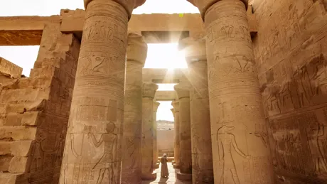 The sun shining brightly through the doorways of the Luxor temple