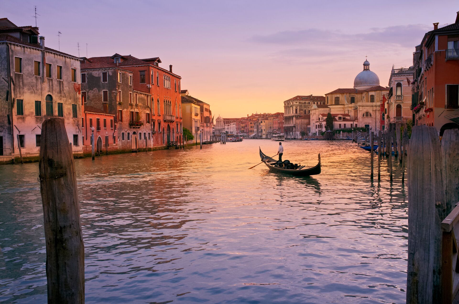 A gondola on a tranquil canal in Venice, Italy