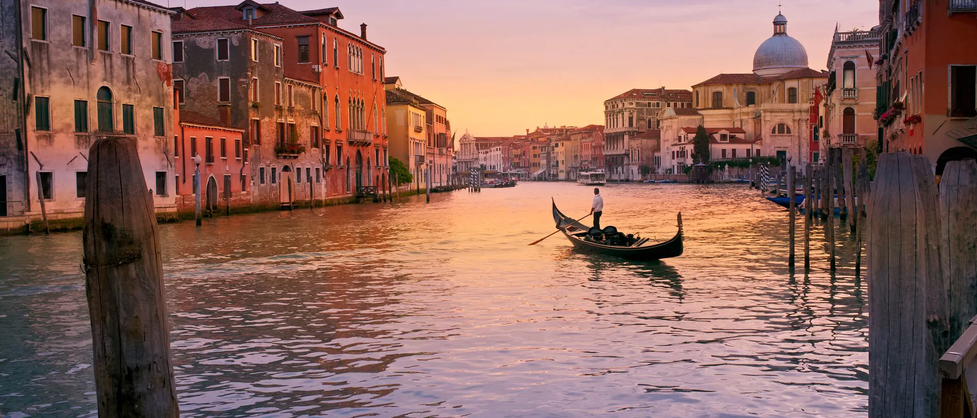 A gondola on a tranquil canal in Venice, Italy