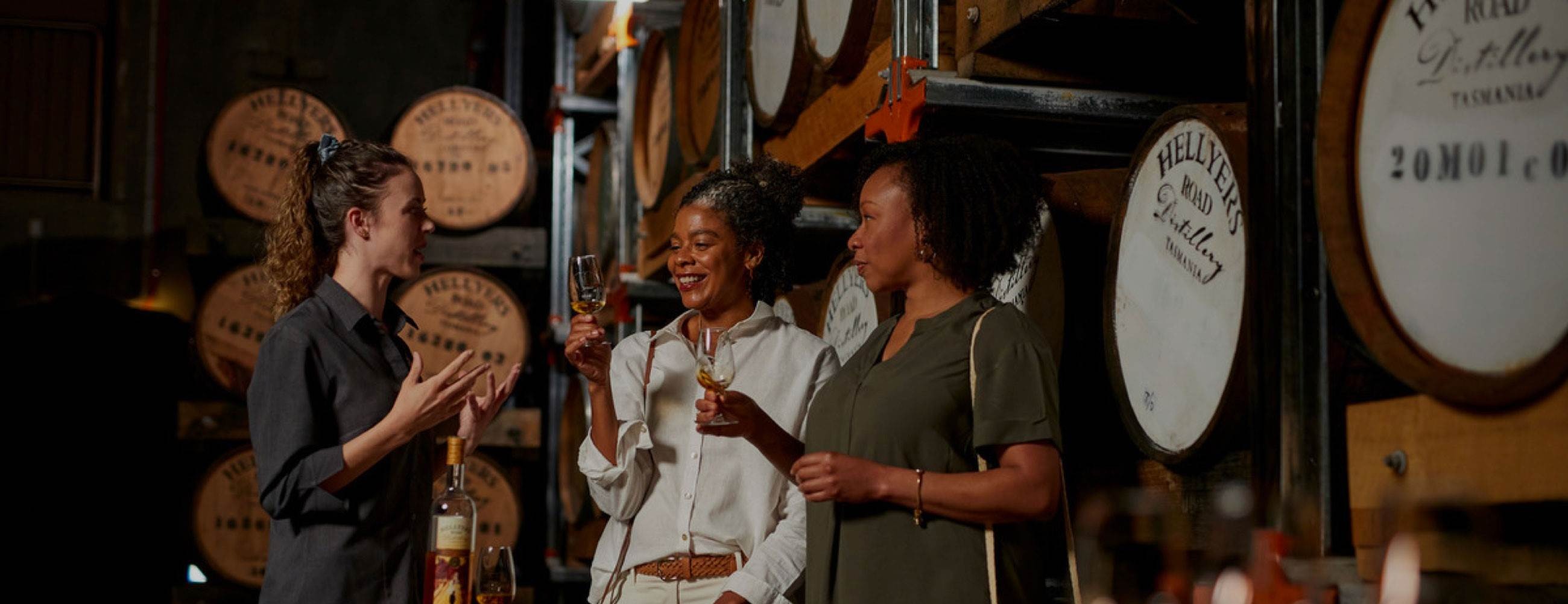 Guests on a custom tour at a whisky distillery tasting