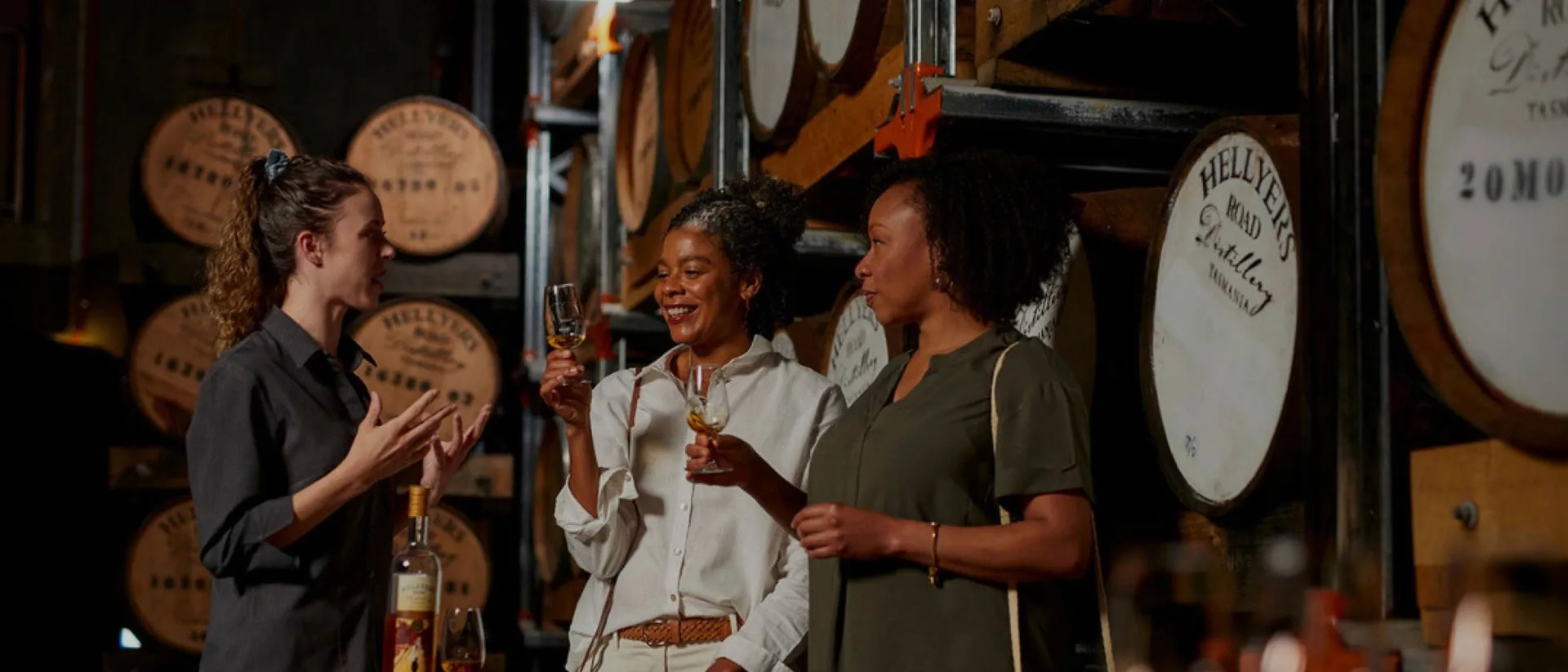 Guests on a custom tour at a whisky distillery tasting