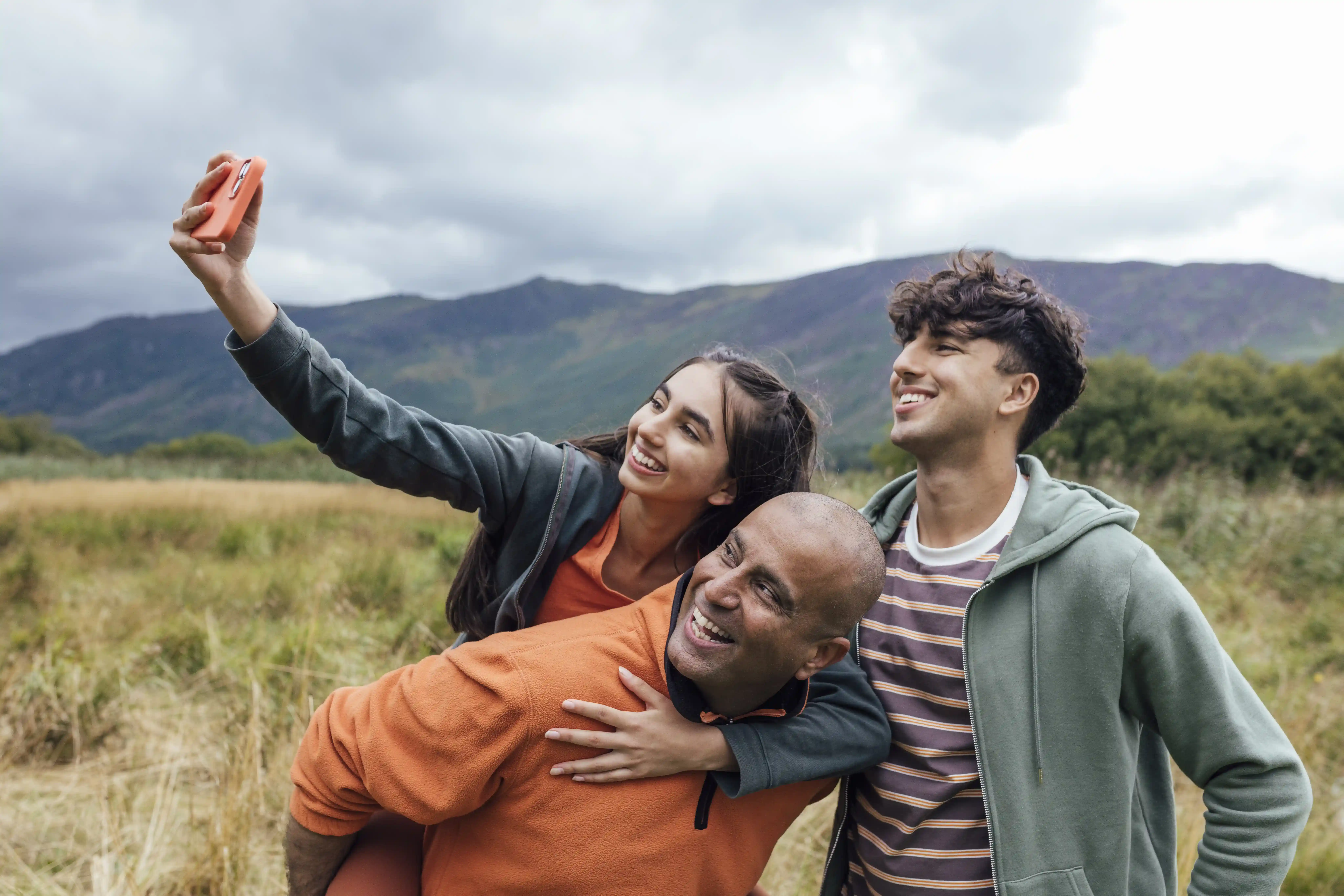 Father, Daughter And Son On A Walk Together In The Countryside