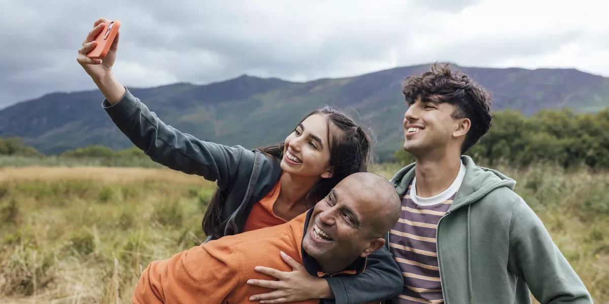 Father, Daughter And Son On A Walk Together In The Countryside