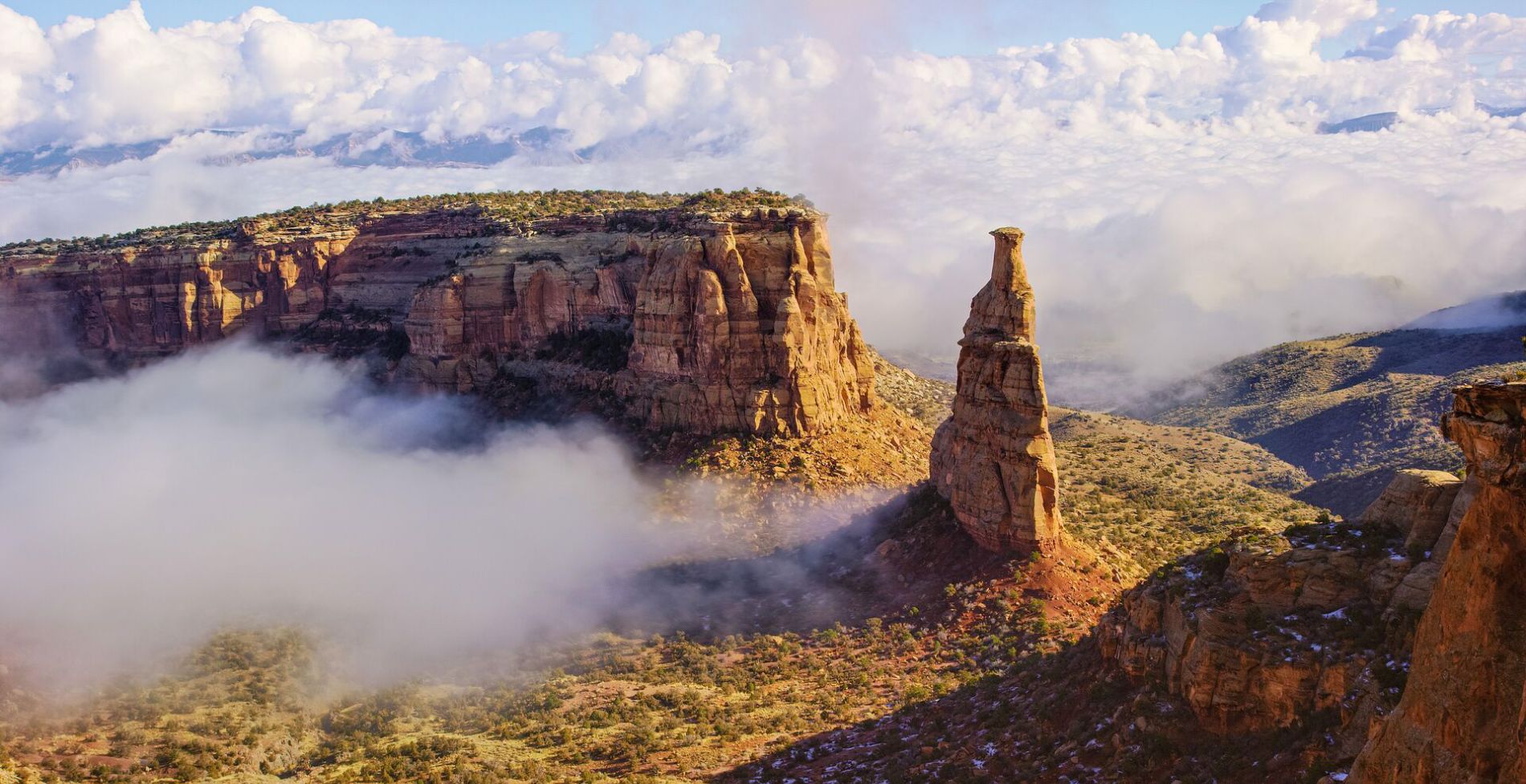 Colorado National Monument with clouds surrounding it