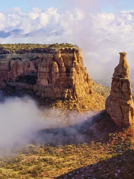Colorado National Monument with clouds surrounding it