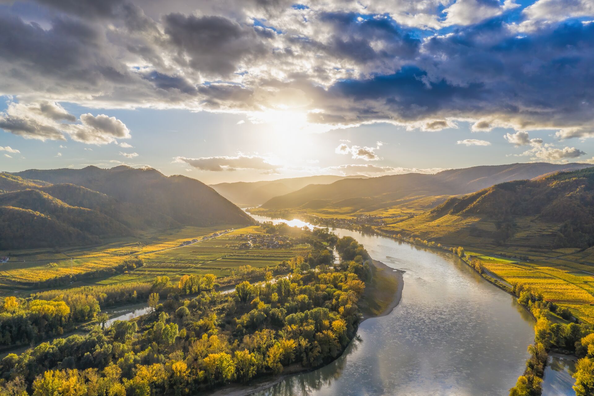 Aerial shot of the Wachau Valley, with the sun reflecting off the River Danube