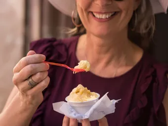 Woman eating ice cream on a summers day in Seville, Spain