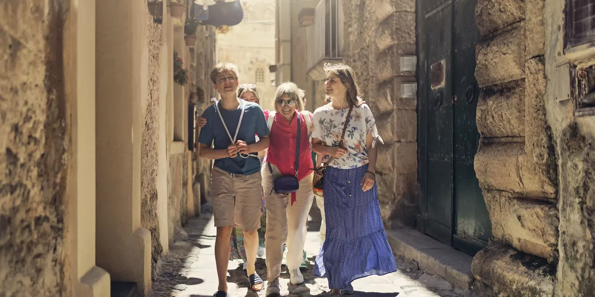 Multi Generation Family Walkingin Narrow Streets