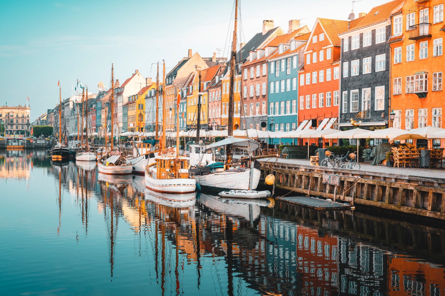 Colourful Townhouses Facades and Old Ships on Nyhavn Canal in Copenhagen, Denmark