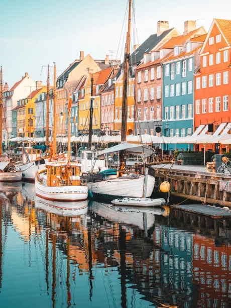 Colourful Townhouses Facades and Old Ships on Nyhavn Canal in Copenhagen, Denmark