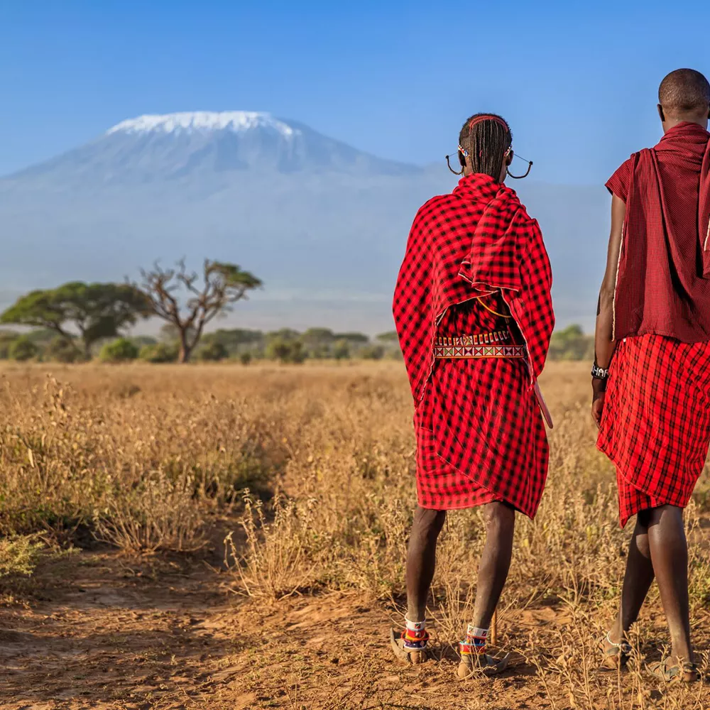 Warriors From Maasai Tribe Looking At Mount Kilimanjaro, Kenya, Africa