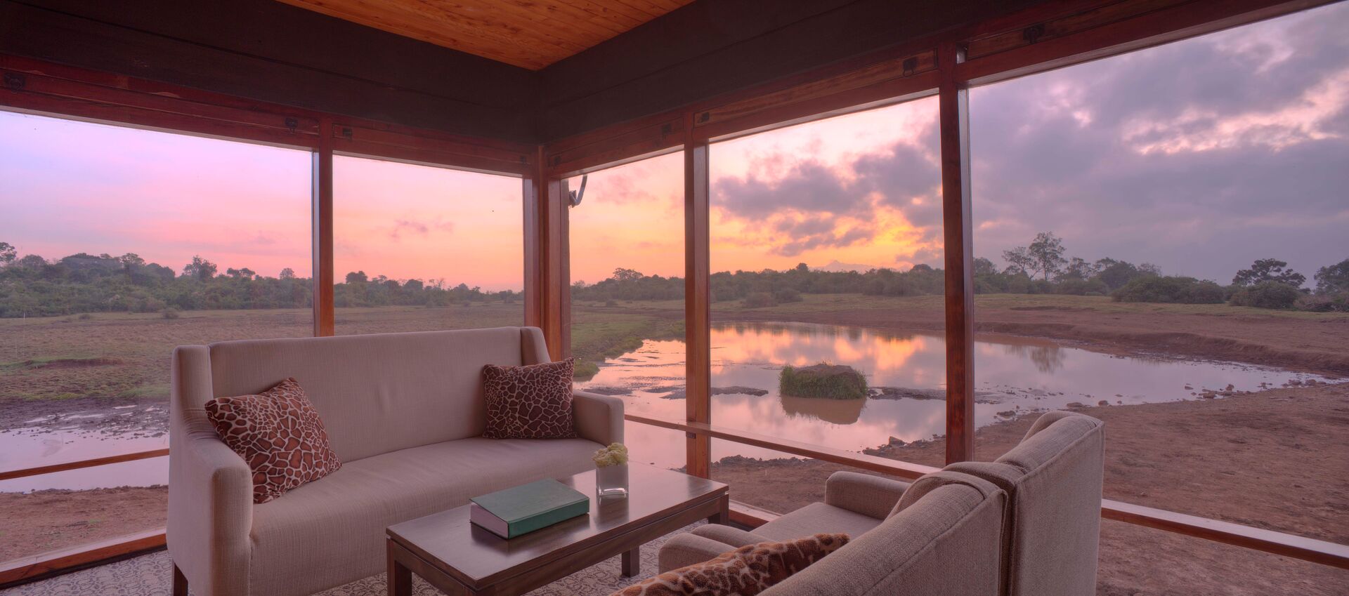 Luxurious interior with lake view of Ark Lodge in Aberdare National Park, Kenya