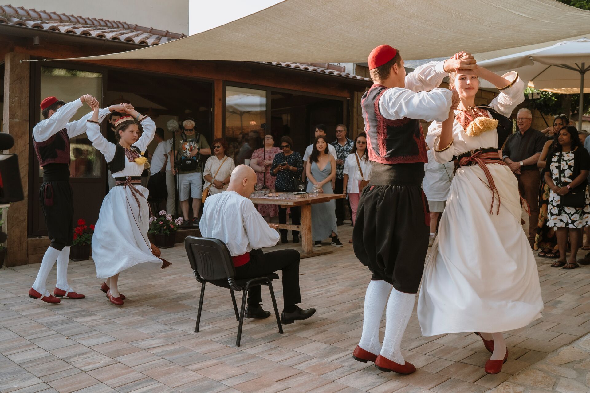 People dancing in traditional costumes in the Balkans