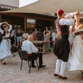 People dancing in traditional costumes in the Balkans