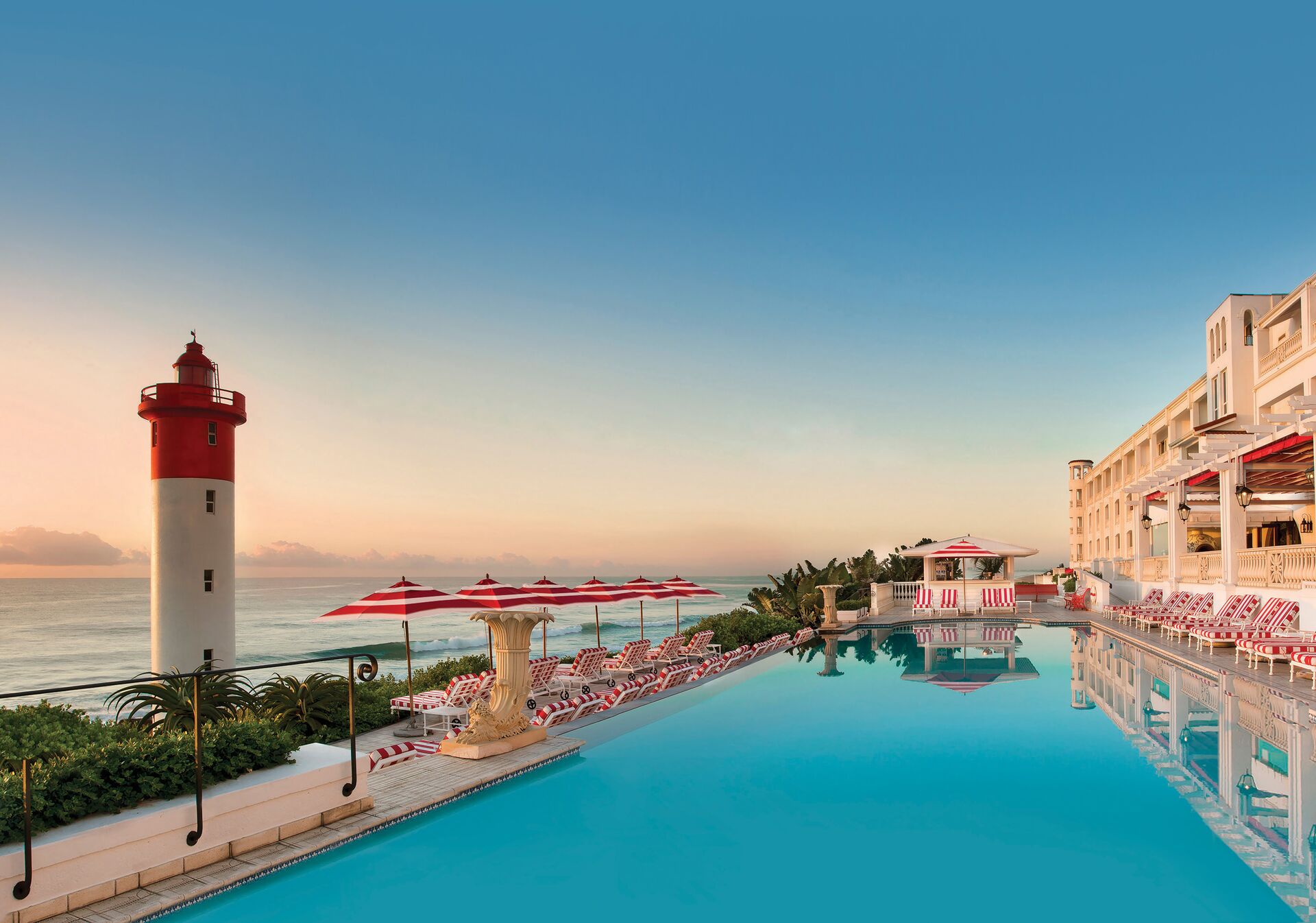 Lighthouse next to swimming pool of Oyster Box Hotel in Durban, South Africa 