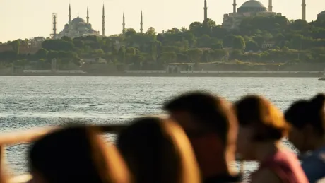 A group of people looking out into the ocean in Istanbul, Turkey