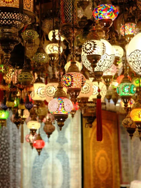 Shop with traditional eastern lamps, lanterns and rugs in Turkey