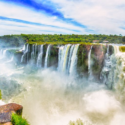 Overlooking Iguazu Waterfall with blue sky backdrop Argentina side