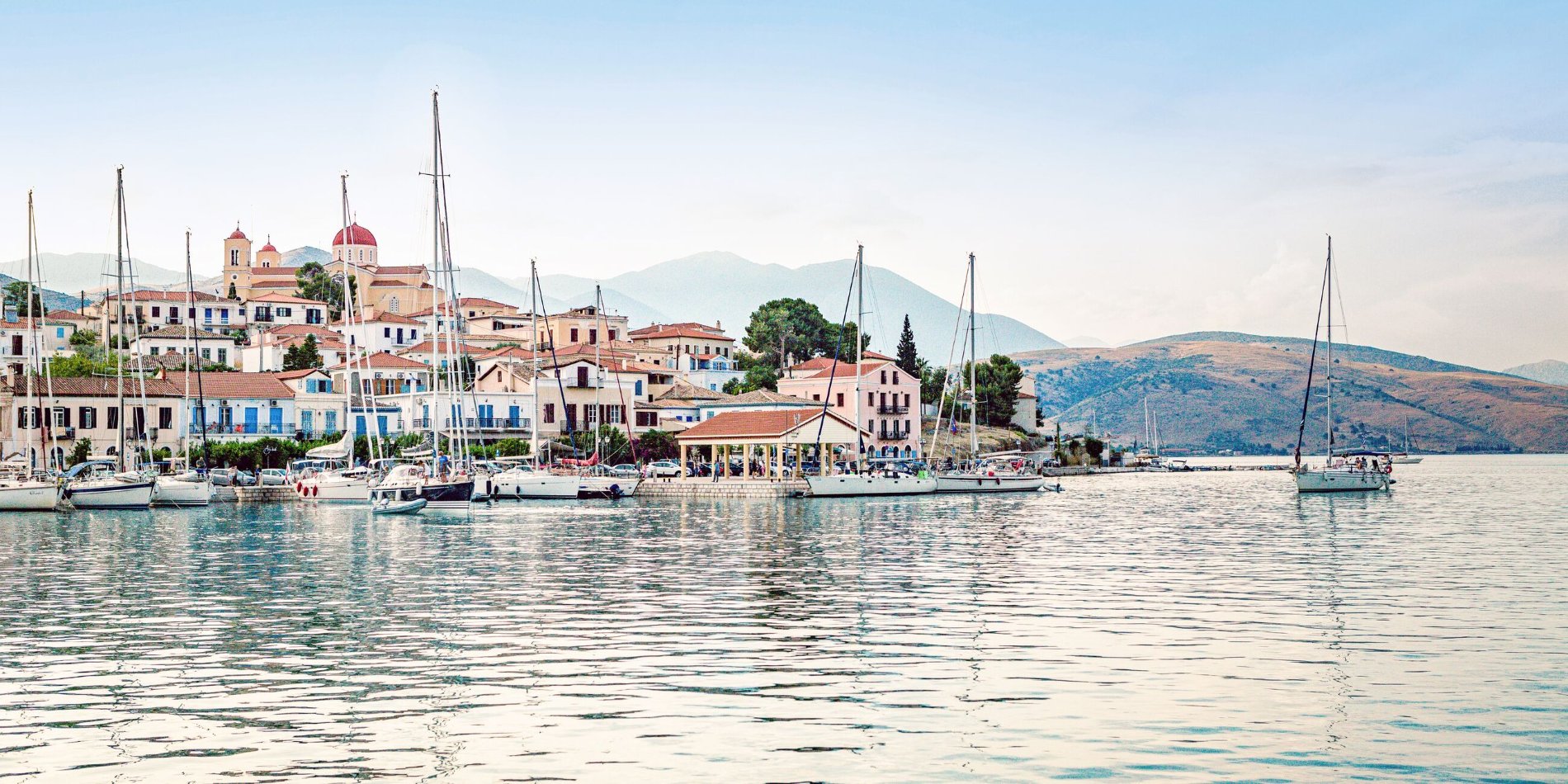 Boat anchored in the Mediterranean Sea, just off the harbour in Galaxidi, Greece