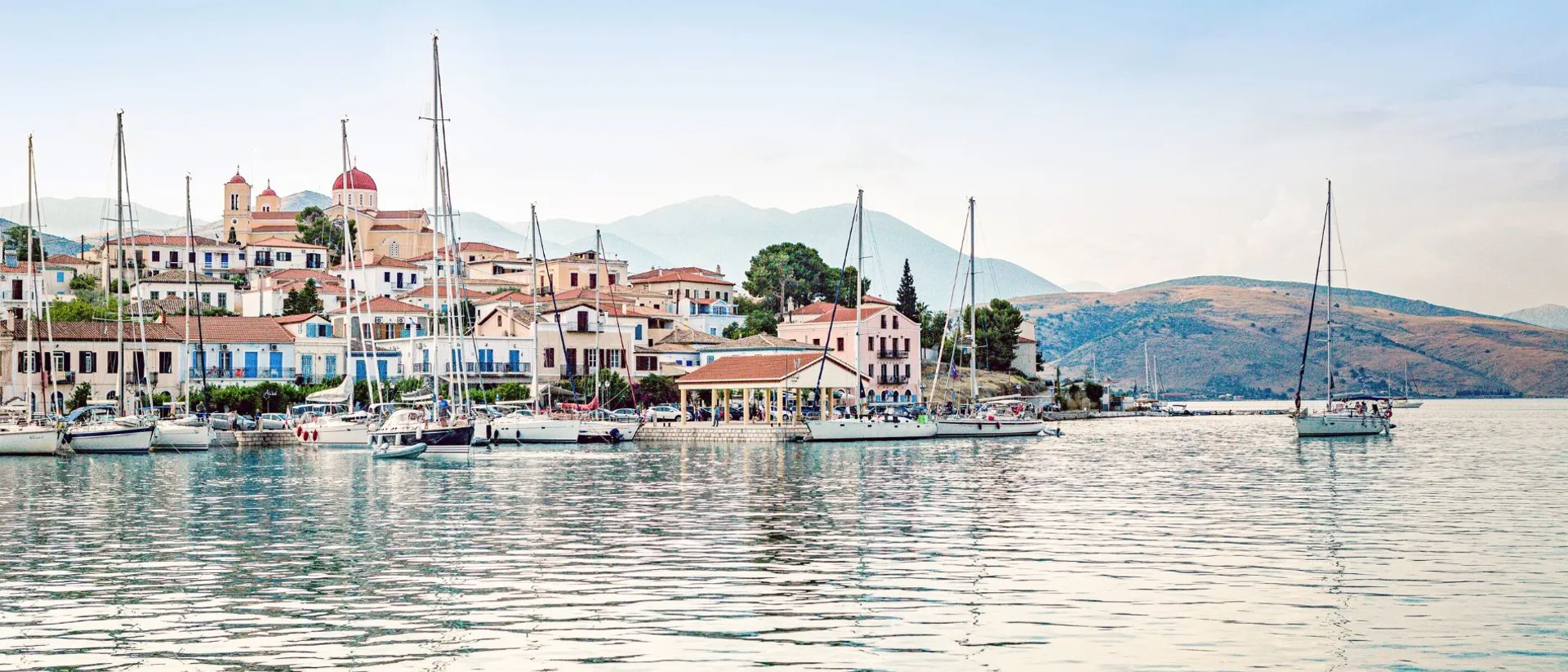 Boat anchored in the Mediterranean Sea, just off the harbour in Galaxidi, Greece
