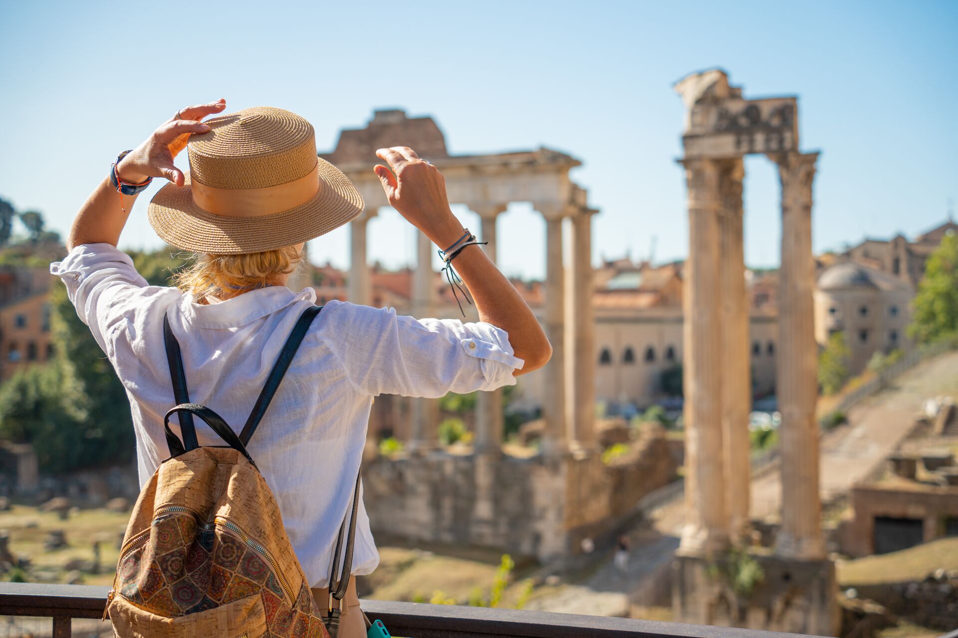 Woman looking at the forum in Rome, Italy