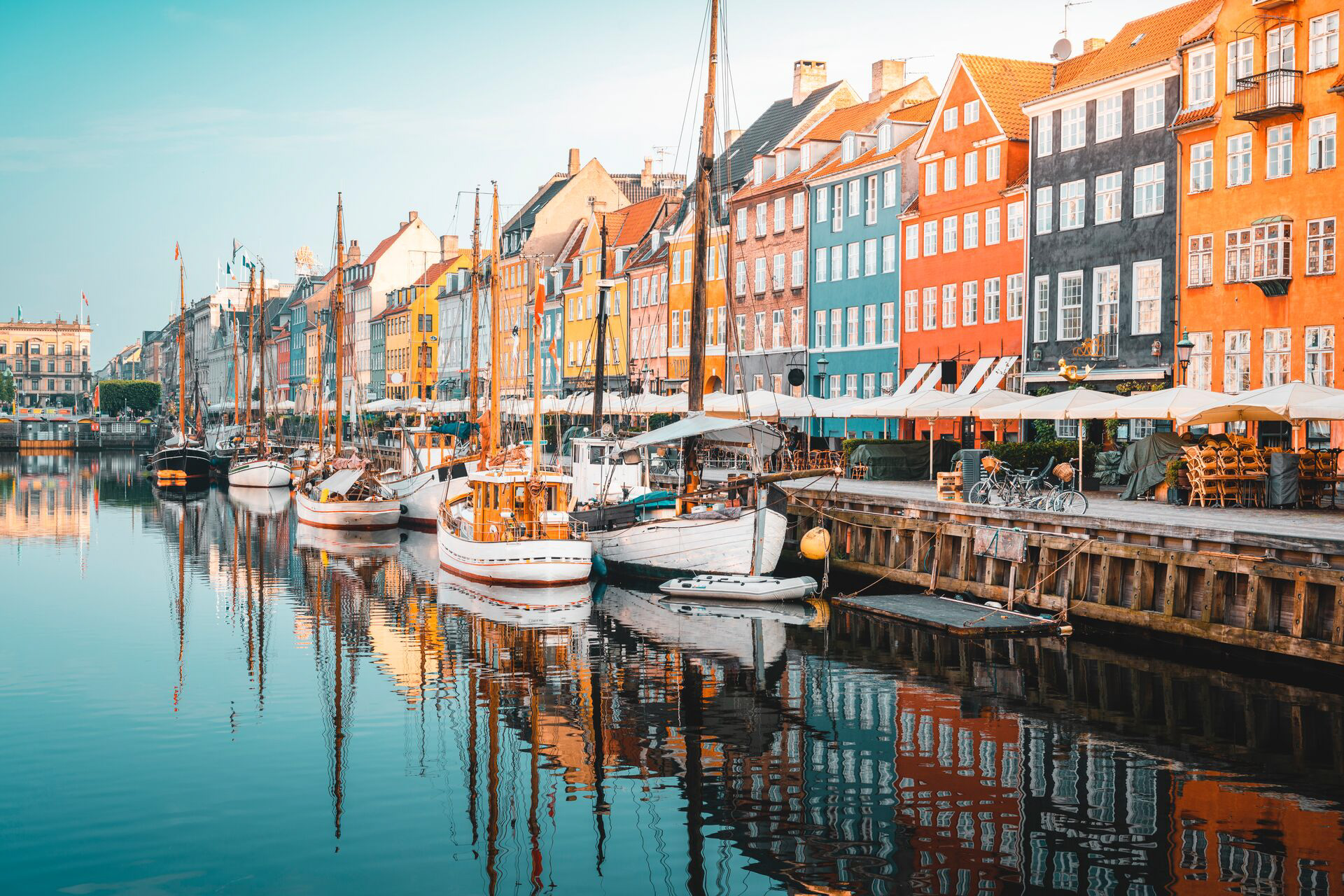 Townhouses and facades along with old ships on Nyhavn Canal in Copenhagen, Denmark