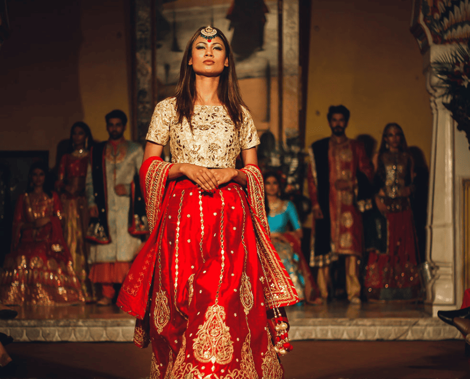 Woman and other people in Bollywood costumes, India