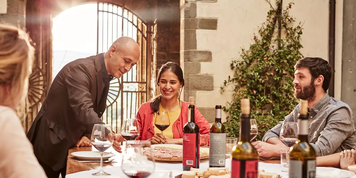 Wine being poured at a BMG experience at Castello Del Trebbio