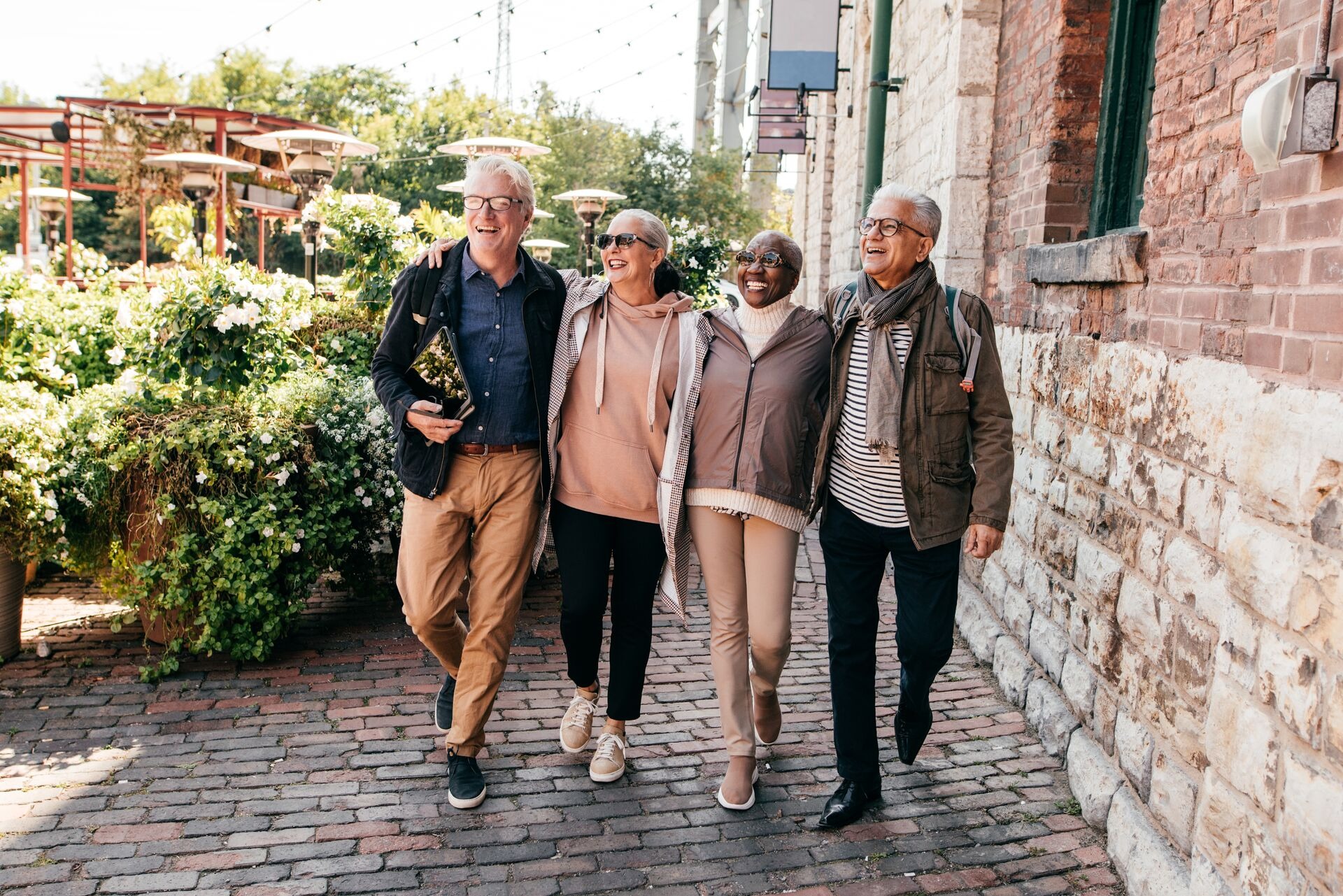 A group of senior people walking and smiling 