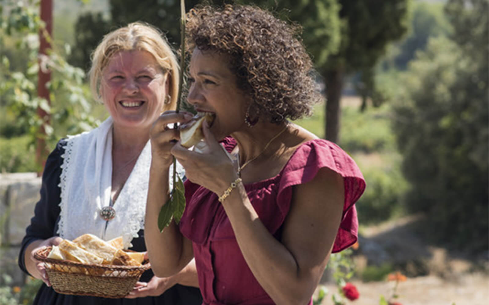 Woman eating bread on a sunny day, Croatia, Dubrovnik