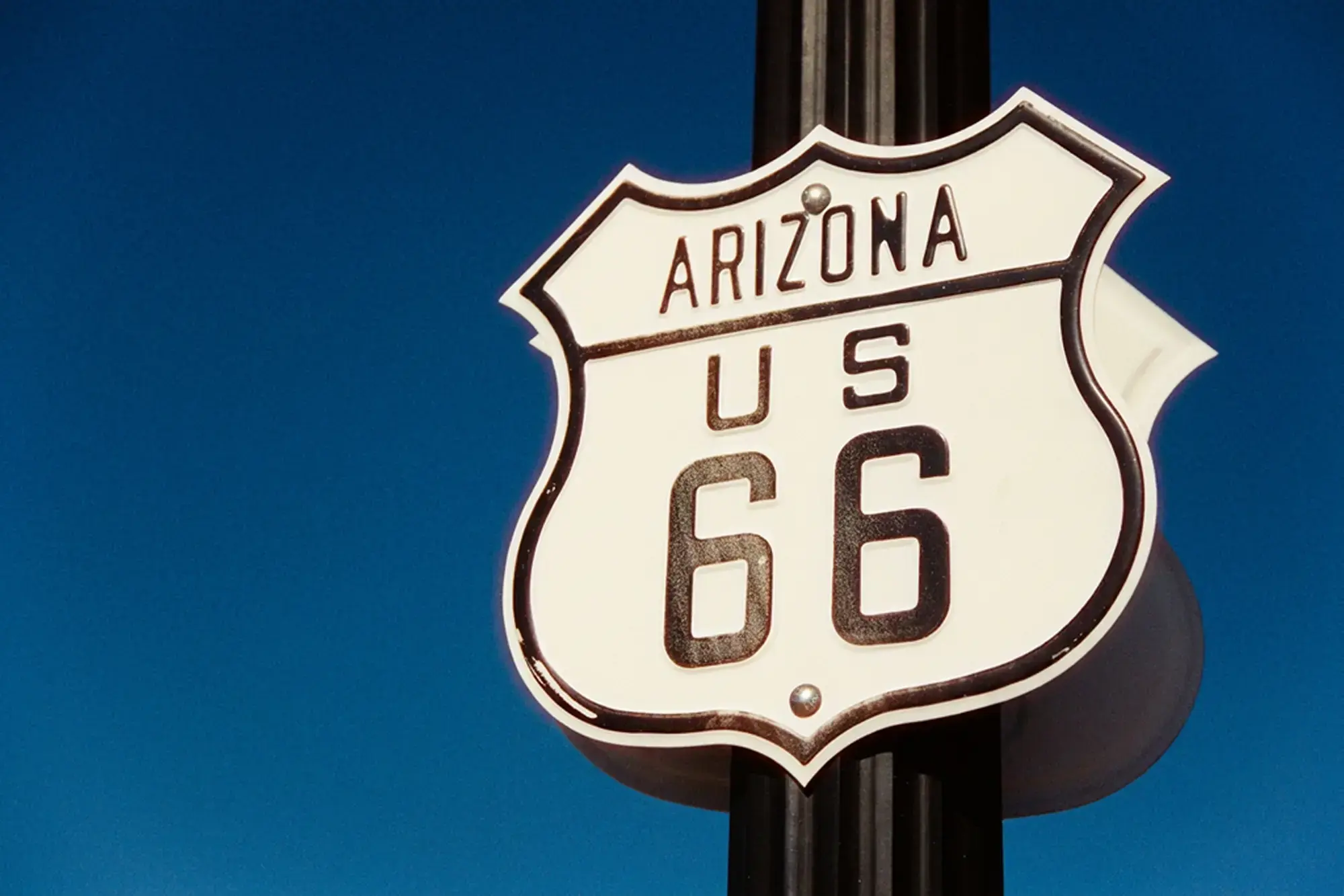 day-hero-route-sixty-six-sign-williams-arizona-usa-512485254.webp