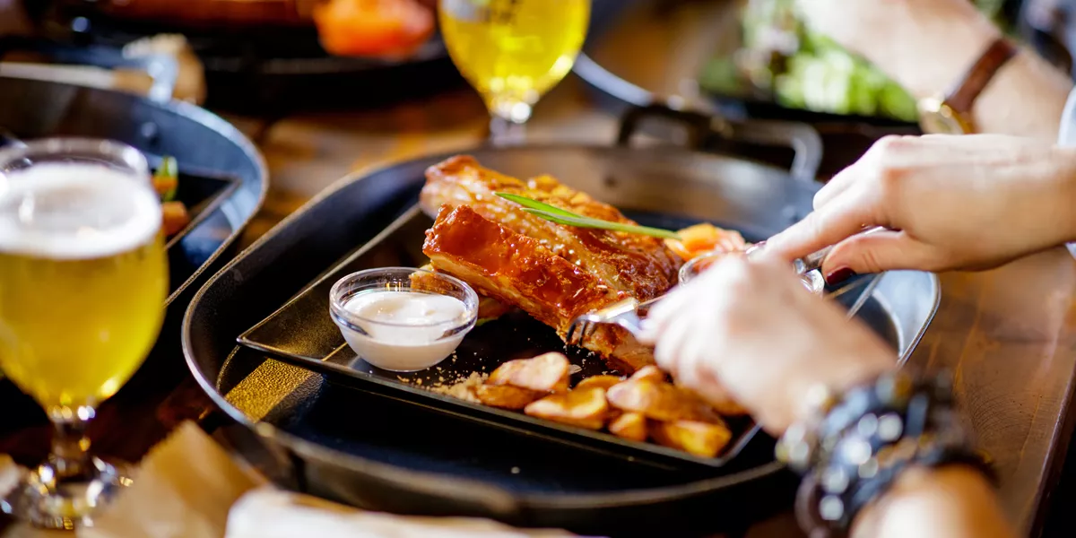 Having Barbecue Pork Sparerib In A Pub 1190146282